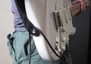 guitar lead through strap